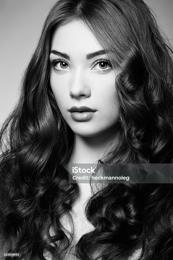 Portrait young beautiful woman with curly hair Portrait young beautiful woman with curly hair. Fashion photo Adult Stock Photo