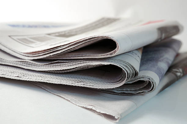quattro quotidiani sovrapposti up - close up newspaper folded document foto e immagini stock