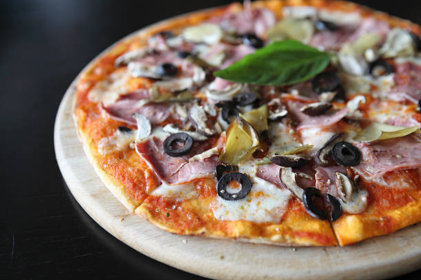 istock Pizza with dry cured ham and basil 523111347