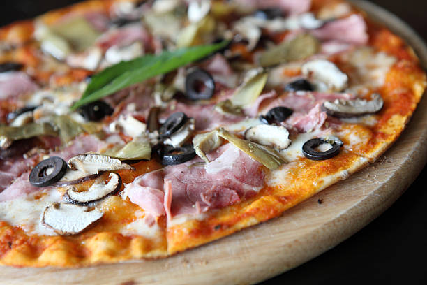 istock Pizza with dry cured ham and basil 523111363