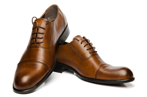 Pair of well-worn, good quality men's shoes.