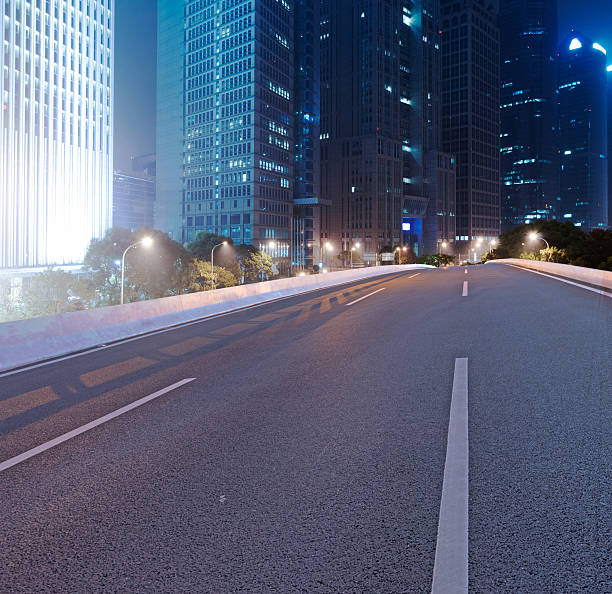 istock Asphalt road and modern city 523114489
