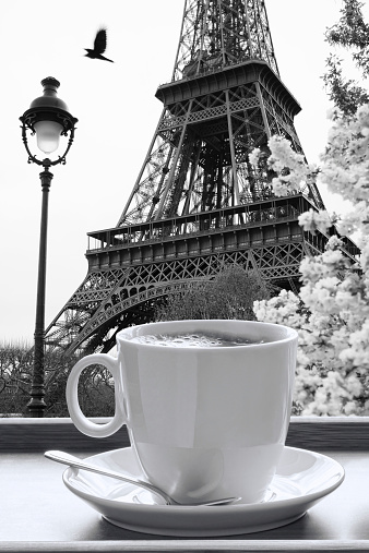 Eiffel Tower with cup of coffee in black and white style,  Paris, France