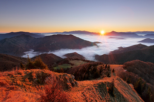 Mountain autumn landscape at sunrise with mist in Slovakia
