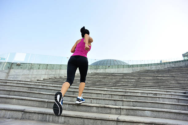 istock Runner athlete running on stairs. 523132271