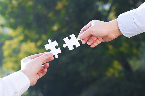 istock puzzle jigsaw and concept with trees background 523133071
