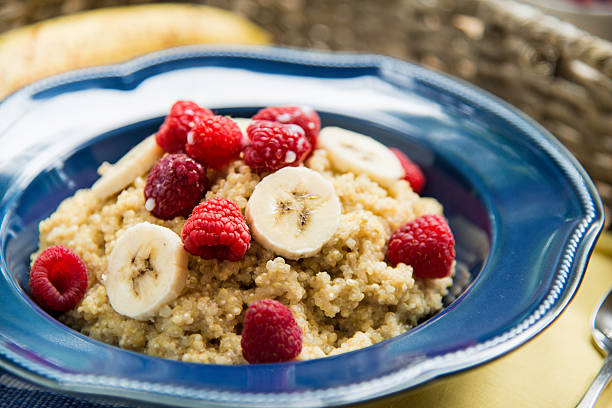 Quinoa Breakfast with Raspberries and Bananas stock photo