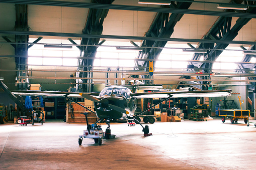 Shot of a light aircraft in a hangar