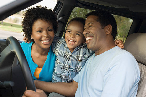 istock Cheerful Boy And Parents Sitting In Car 523136091