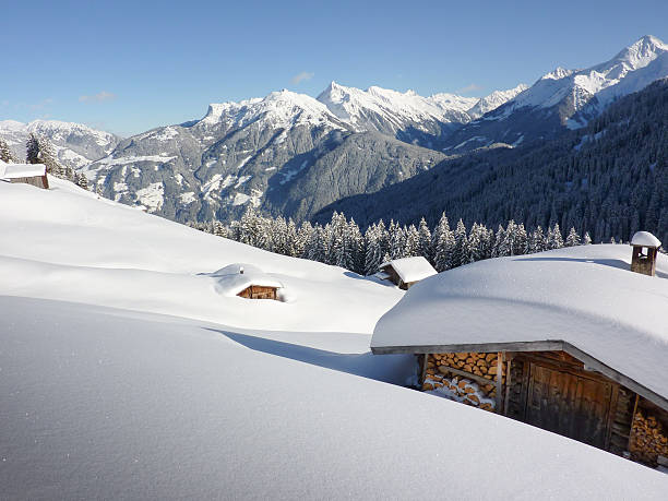istock snow-covered ski huts in the Alps 523137275