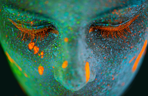 Shot of a young  woman posing with neon paint on her facehttp://195.154.178.81/DATA/shoots/ic_784268.jpg