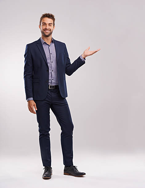 Success is yours for the taking Studio shot of a well-dressed man against a gray background blazer jacket stock pictures, royalty-free photos & images