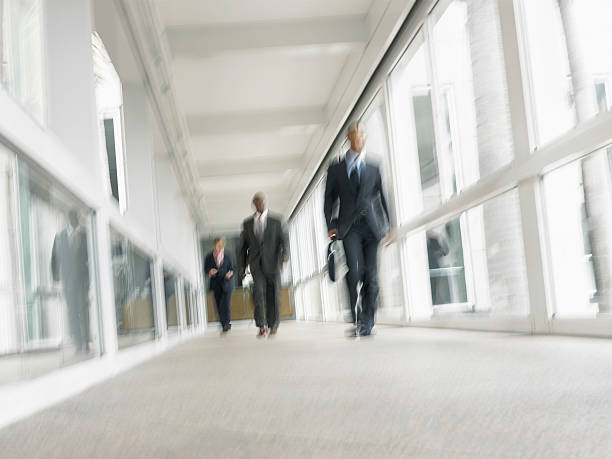 istock Multiethnic Businessmen Walking In Office Corridor 523138449