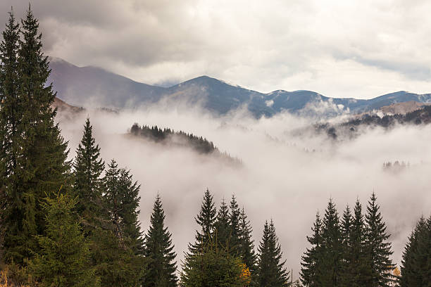 istock global warming. mountain landscape. Clouds and fog 523145265