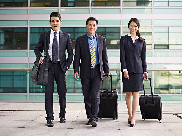 アジアのビジネスチーム - walking people business travel business ストックフォトと画像