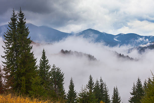 istock global warming. mountain landscape. Clouds and fog 523146849