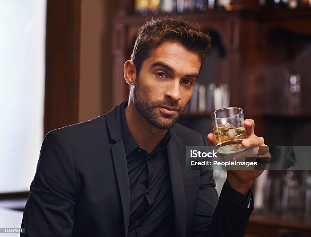 Here's to us Cropped shot of a handsome and confident young man Men Stock Photo