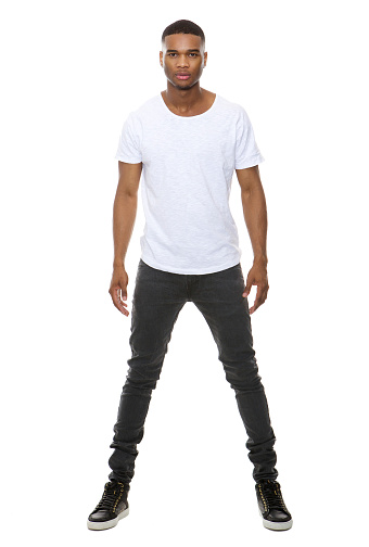 Full length portrait of a handsome african american male fashion model posing on isolated white background