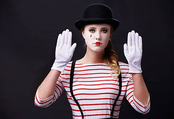Where is this wall? Studio shot of a female mime clown photos stock pictures, royalty-free photos & images