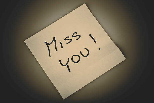 istock Yellow note paper miss you message 523150359