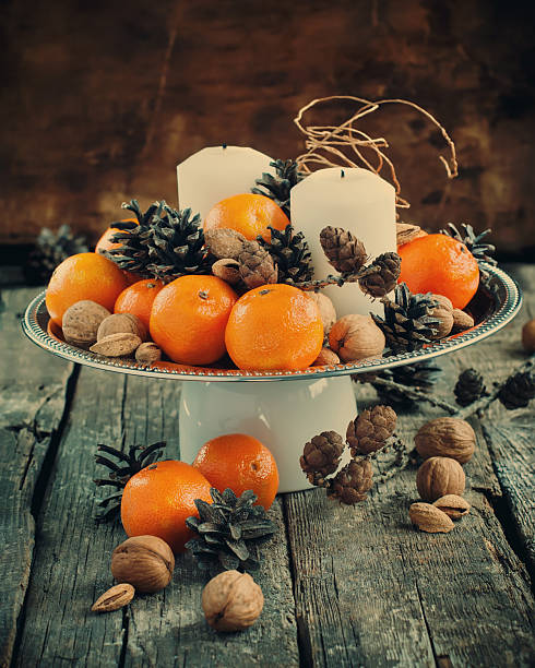 Christmas Composition with Tangerines, Pine cones, Walnuts