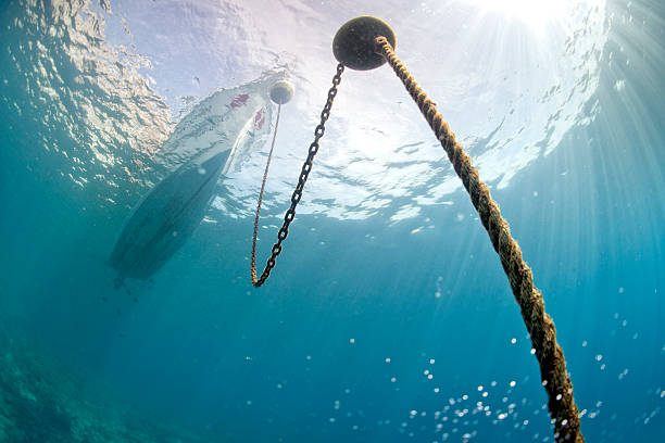 istock boat chain anchor from underwater 523152455