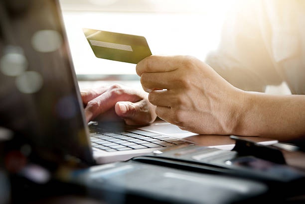istock Online shopping.Hands holding credit card and using laptop. 523156020