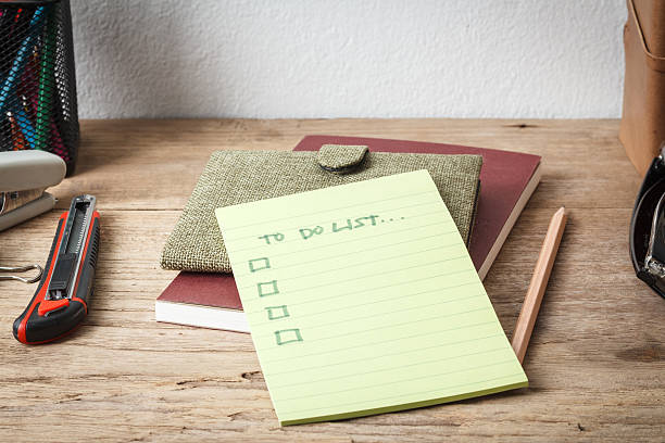 istock small notebook with a to do list and a pen 523157112