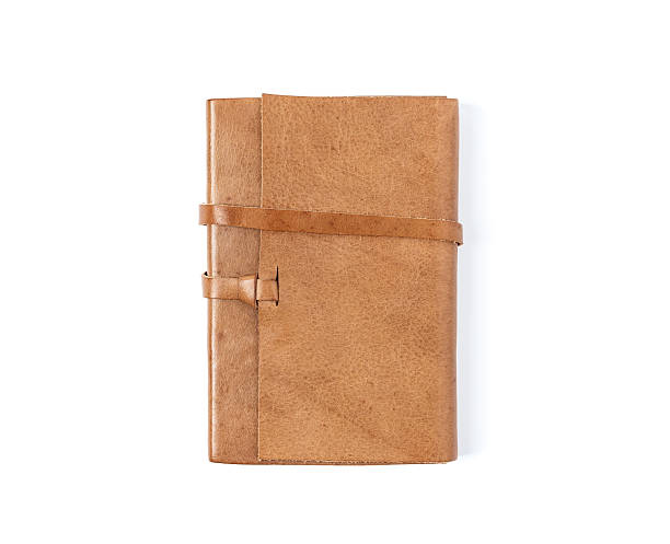 ブラウンレザーのノート白背景 - leather folder ストックフォトと画像
