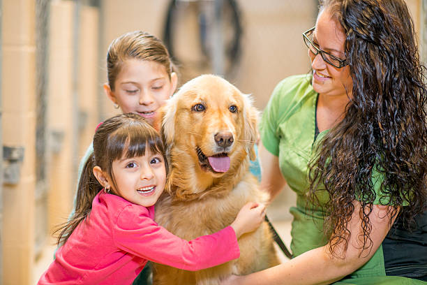 istock Two Sisters Adopting a Dog 523158058