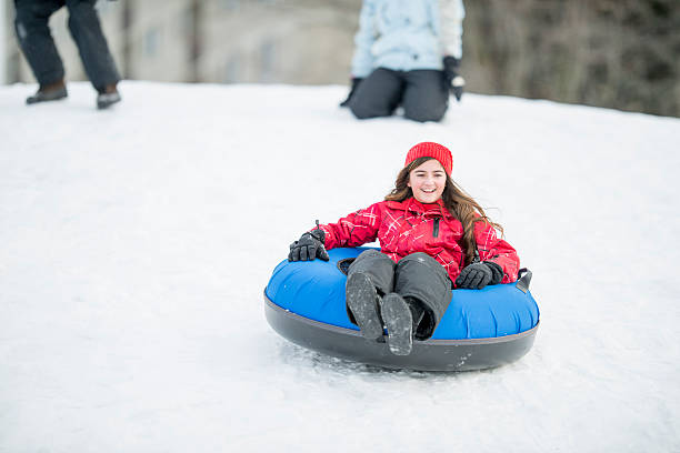 istock Young Girl Sledding Down a Hill 523158128