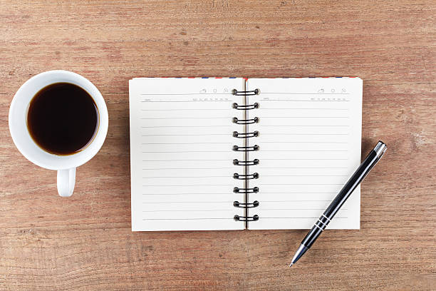 istock Blank open notebook with coffee cup, Business template mock up 523158286