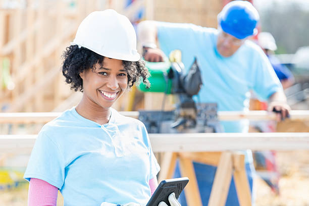 istock Confident female construction volunteer at work site 523159344
