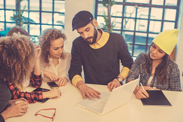 istock young people having meeting at the office 523159638
