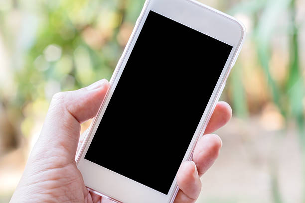 istock Hand holding phone blur background with clipping path inside 523160140