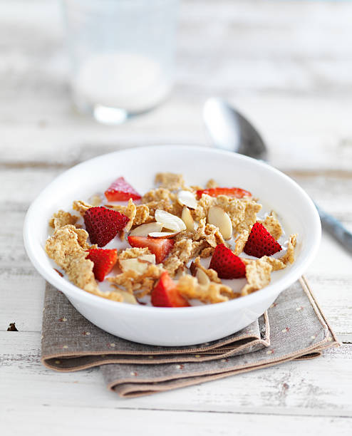 istock breakfast cereal bowl with sliced almonds and chopped strawberries 523160922
