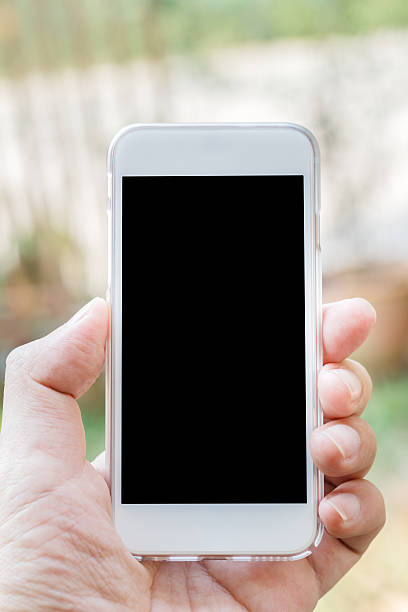 istock Hand holding phone blur background with clipping path inside 523160992