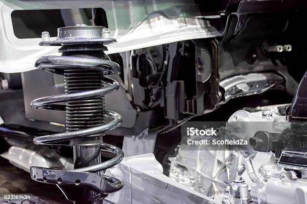 Shock Absorber And Car Suspension In Background Stock Photo - Download Image Now - Activity, Adjustable, Affectionate