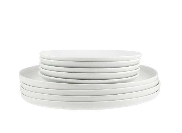 istock Pile of clean white dish plates isolated 523162842