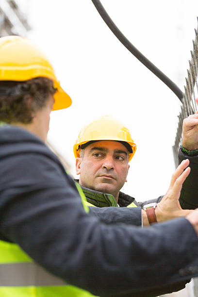 istock Vertical shot of engineer and architect with hardhat 523163046