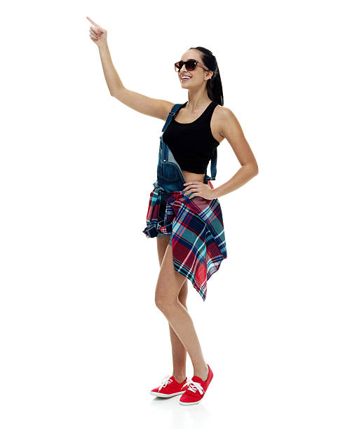 istock Smiling female pointing away 523163160