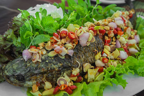 istock Fish Serve with Herb and Spicy Sauce 523164404