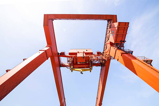 istock Cargo cranes on rails and cargo warehouses in the seaport 523164802
