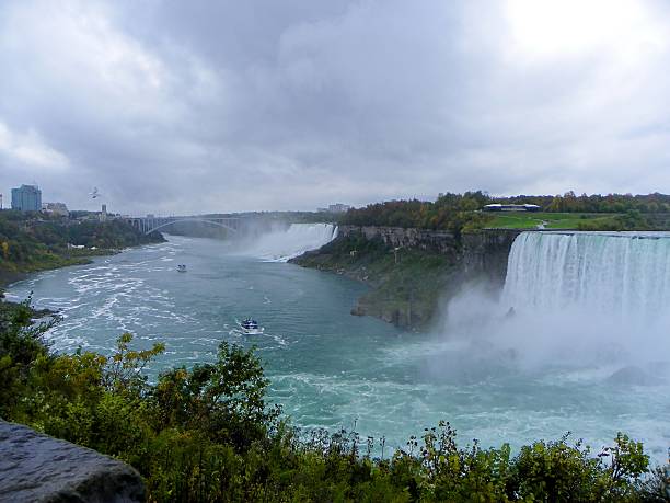 istock Two boats and waterfalls 523165671