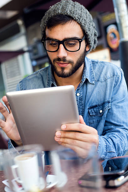 istock Modern young man with digital tablet in the street. 523166751