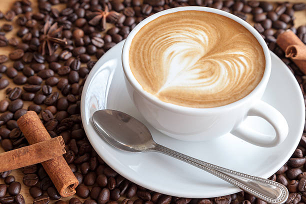 istock hot coffee with coffee beans and herbs 523168404