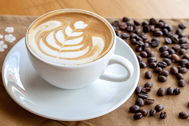 istock coffee with coffee beans on the wood table 523168616