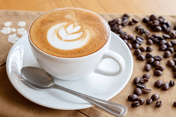 istock coffee with coffee beans on the wood table 523168750