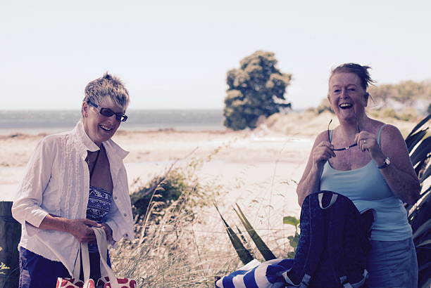 istock Senior Ladies on Beach Laughing 523169160