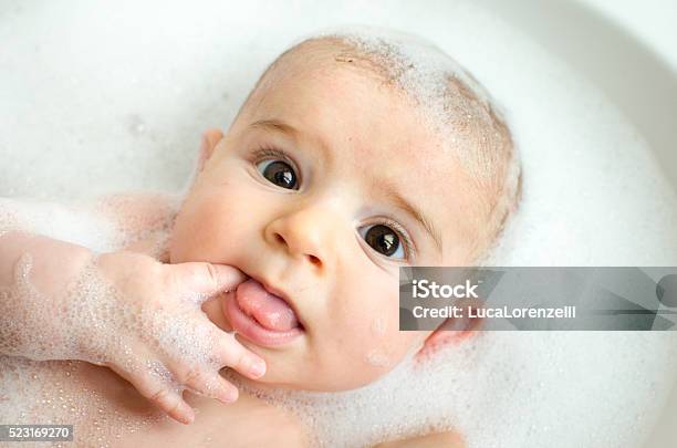 Newborn Bubble Bath White Foam Fingers Eat Washing Baby Care Stock Photo - Download Image Now